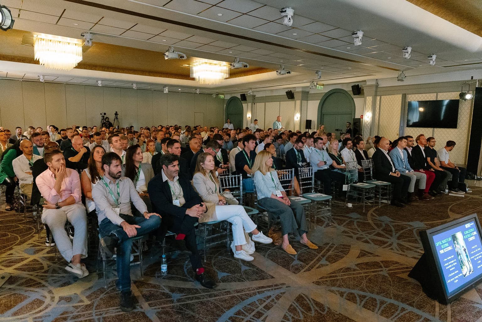 A packed ballroom during a session at the 2025 summit