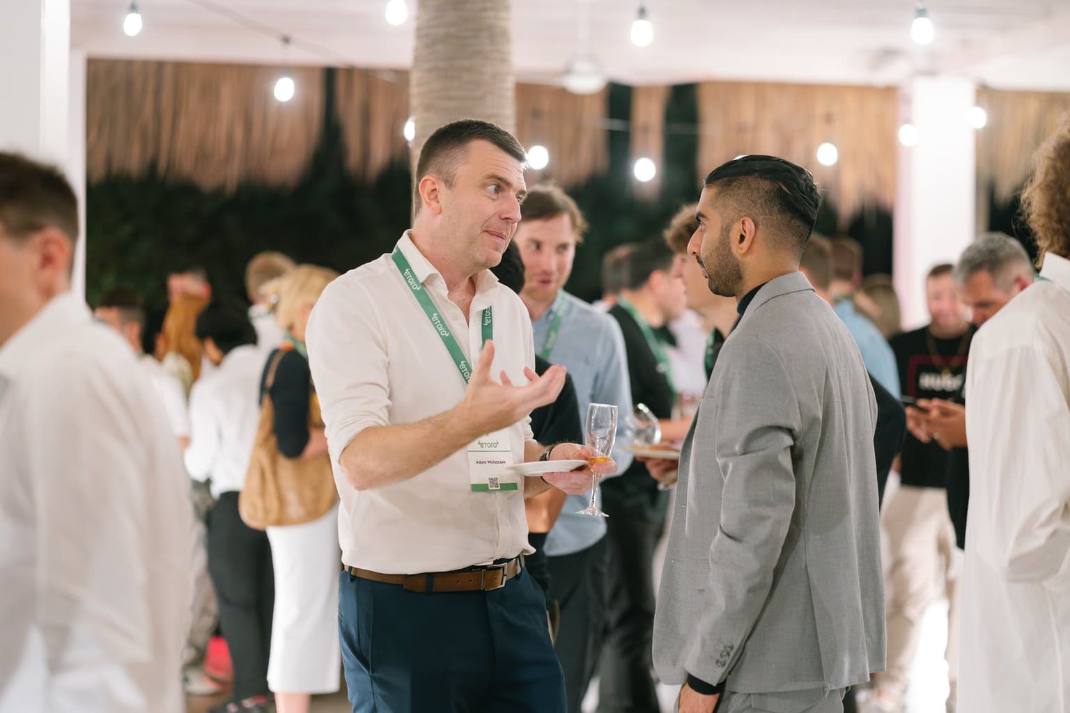 Attendees talking at the evening reception