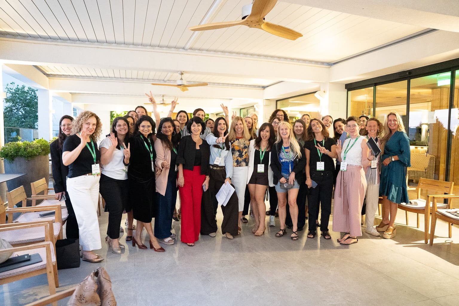 Group photo of attendees on the terrace
